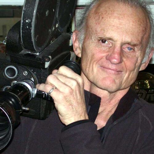 Stephen Kastner, founder of DesignWise Studios pictured with a retro 16mm film camera